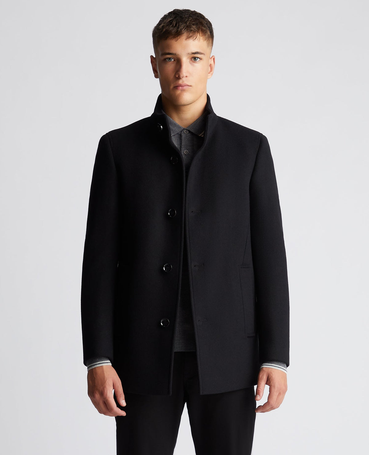 Man wearing a black Tapered Fit Wool-Mix Tailored Coat