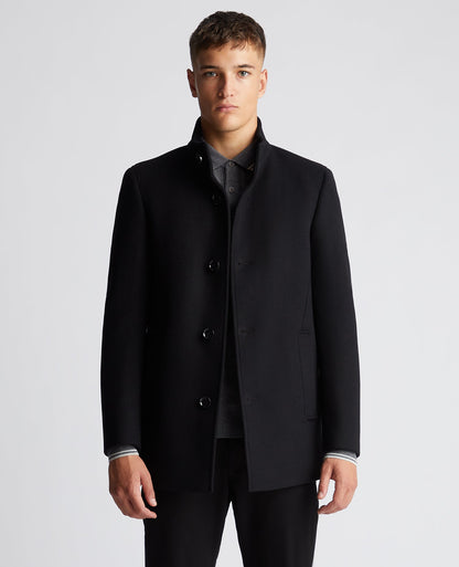 Man wearing a black Tapered Fit Wool-Mix Tailored Coat