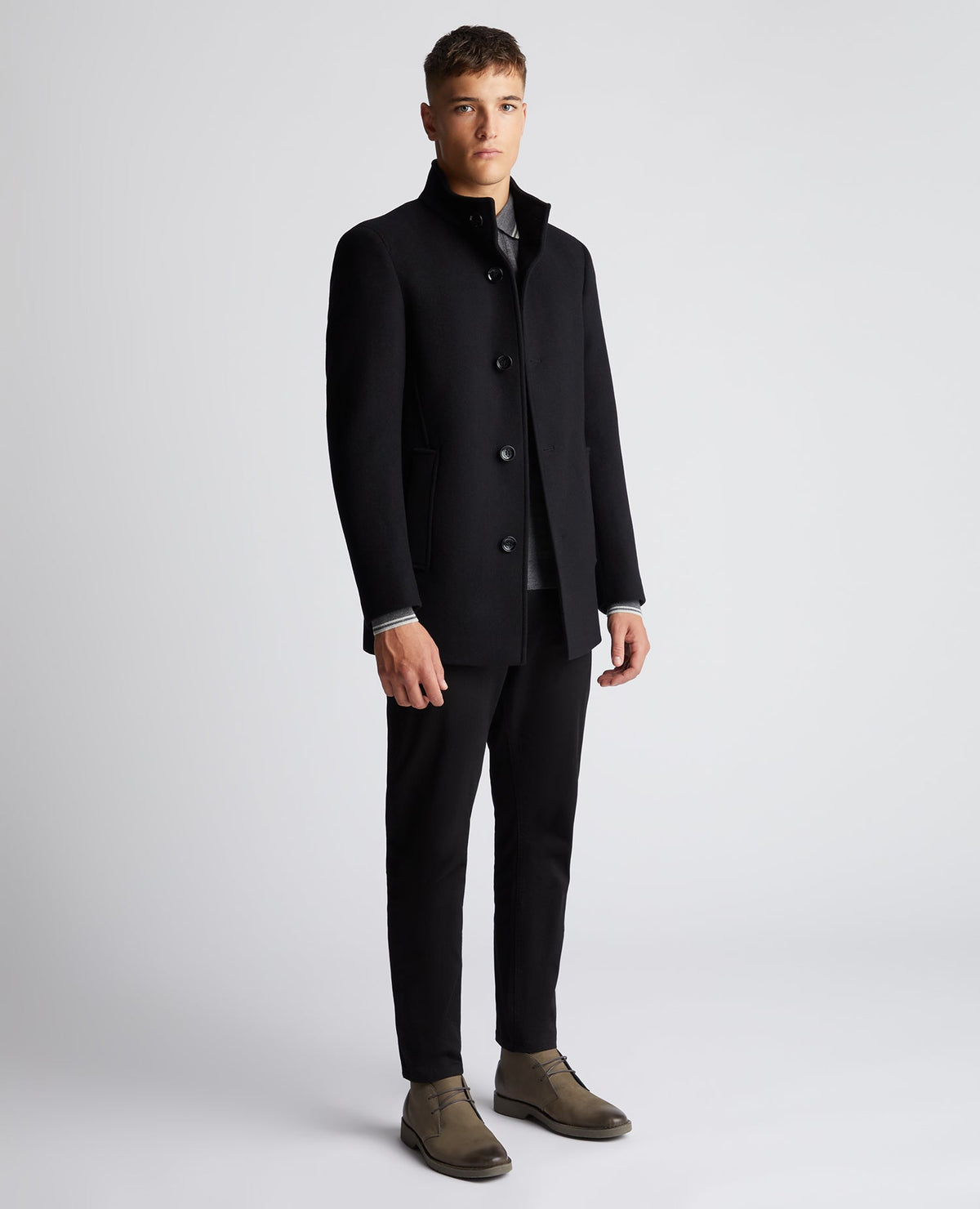 Man wearing a black Tapered Fit Wool-Mix Tailored Coat