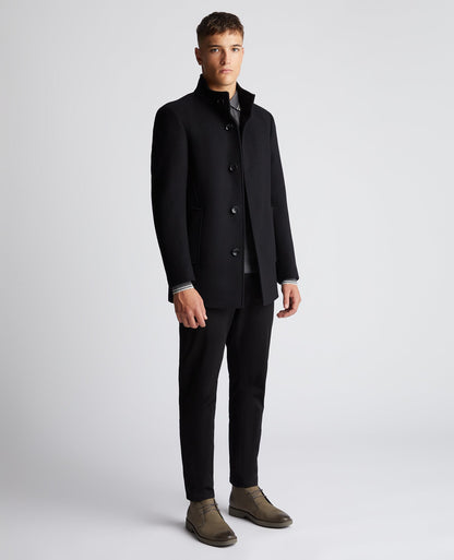 Man wearing a black Tapered Fit Wool-Mix Tailored Coat
