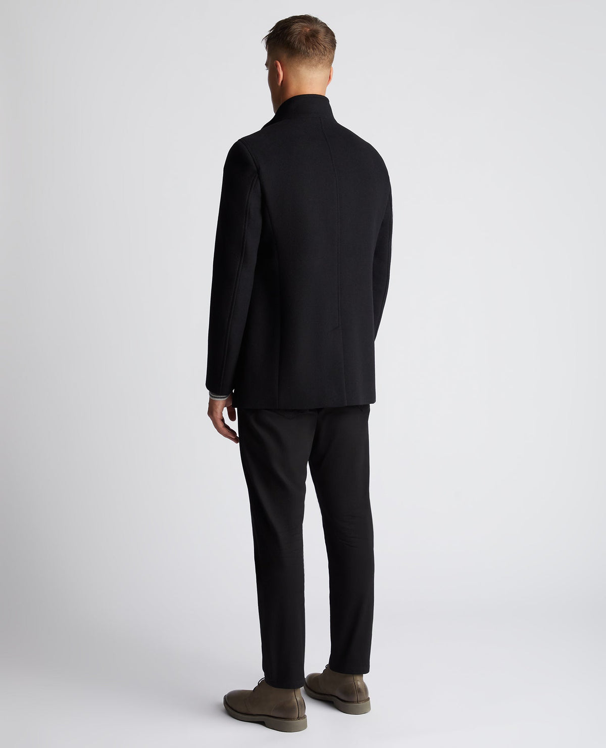 Man wearing a black Tapered Fit Wool-Mix Tailored Coat