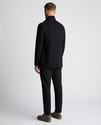 Man wearing a black Tapered Fit Wool-Mix Tailored Coat