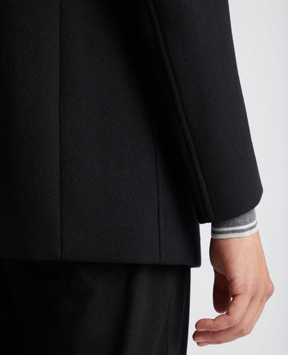 Man wearing a black Tapered Fit Wool-Mix Tailored Coat