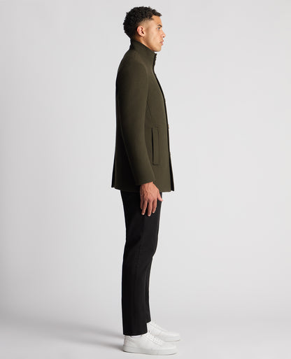 Man wearing a green Tapered Fit Wool-Blend Overcoat