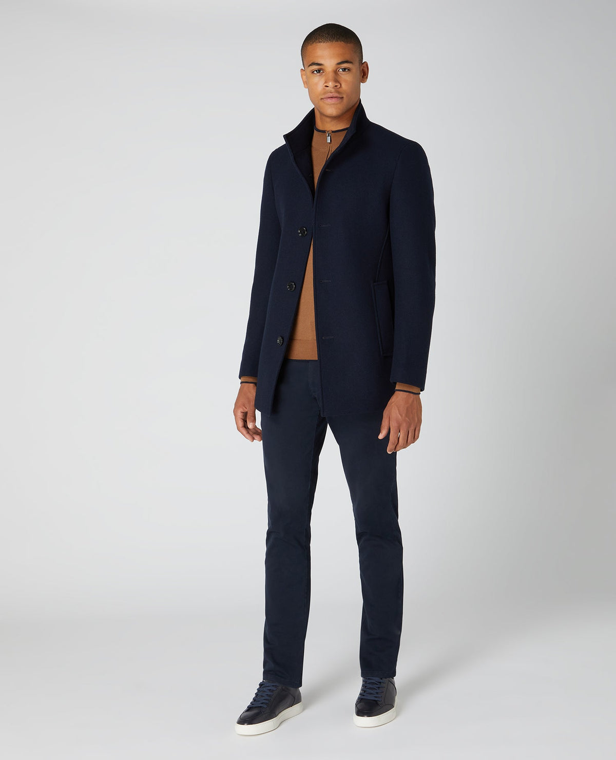 Man wearing a navy Tapered Fit Wool-Blend Tailored Coat