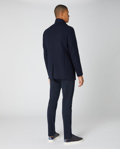Man wearing a navy Tapered Fit Wool-Blend Tailored Coat