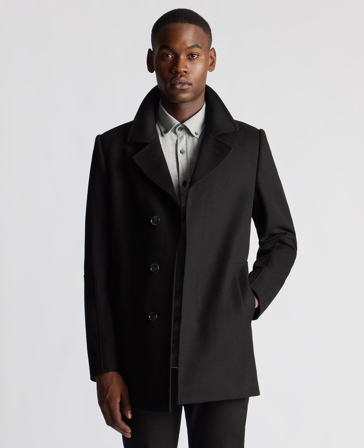 Man wearing a black Tailored Fit Overcoat