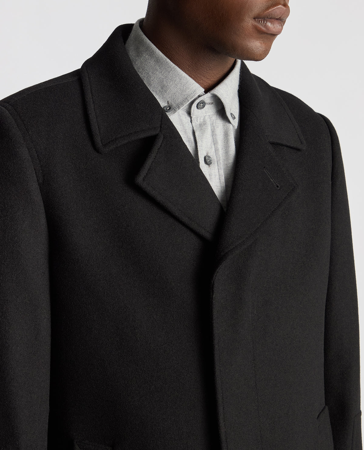 Man wearing a black Tailored Fit Overcoat