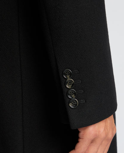 Man wearing a black Kayden Tailored Fit Chelsea Overcoat