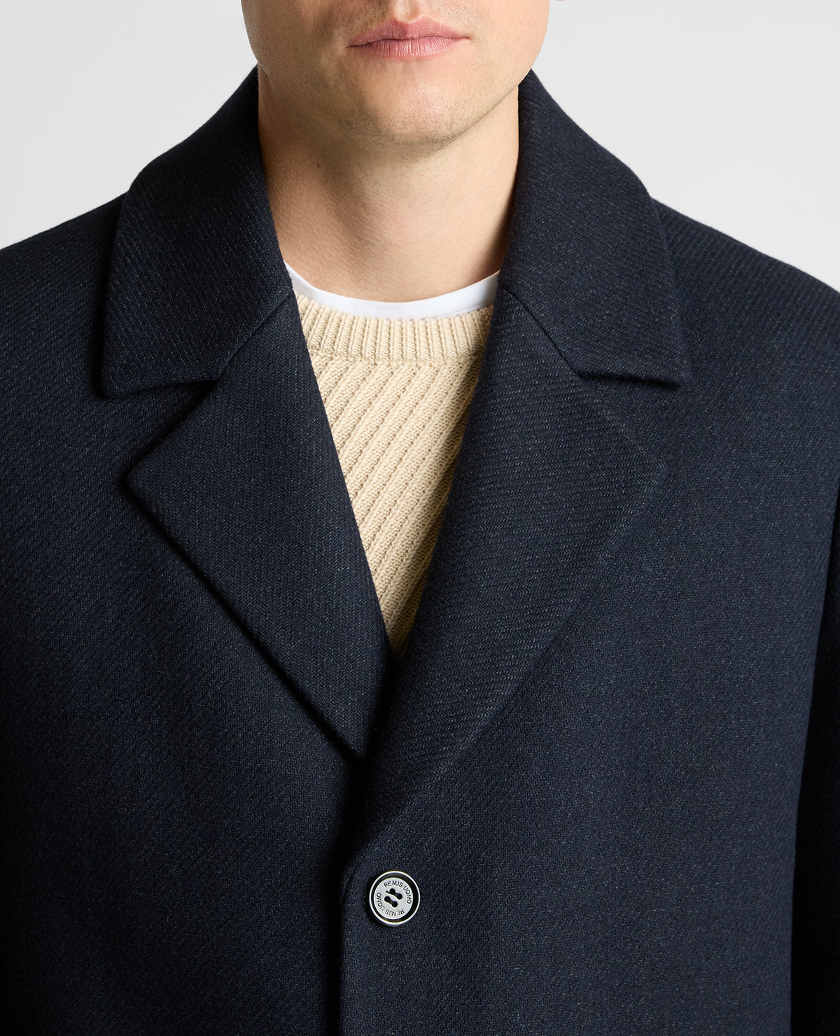 Man wearing a navy Dylan Relaxed Fit Wool Blend Coat