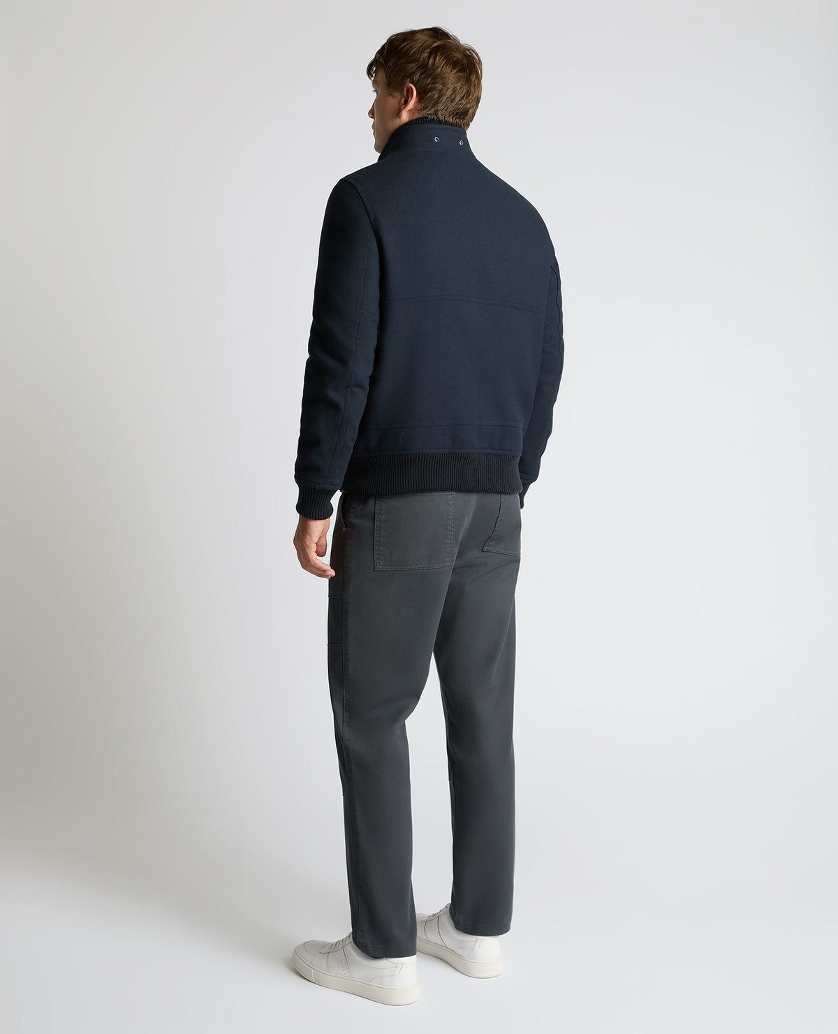 Man wearing a navy Braxton Regular Fit Twill Jacket