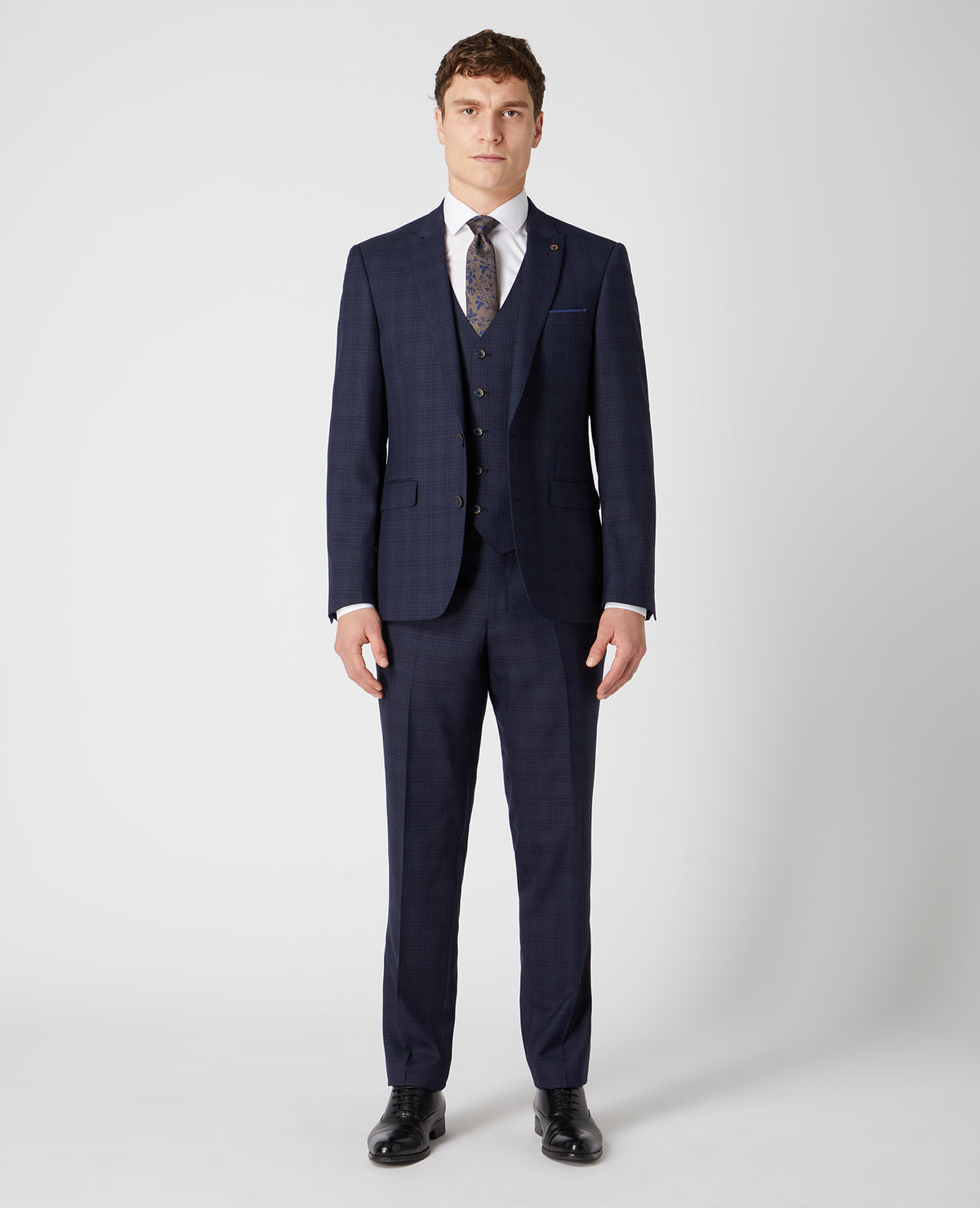 Man wearing a navy Tapered Fit Checked Wool Rich Mix and Match Suit
