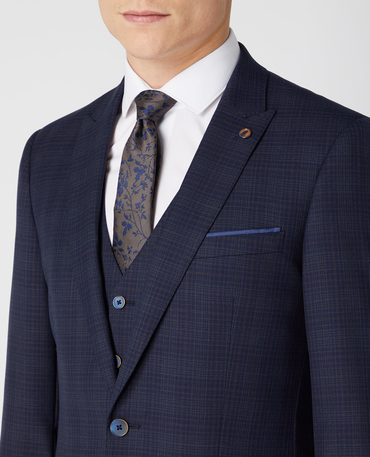 Man wearing a navy Tapered Fit Checked Wool Rich Mix and Match Suit