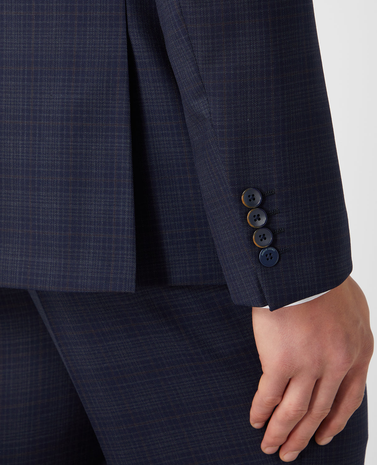 Man wearing a navy Tapered Fit Checked Wool Rich Mix and Match Suit