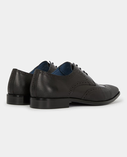 Man wearing a black Leather Russo Shoe