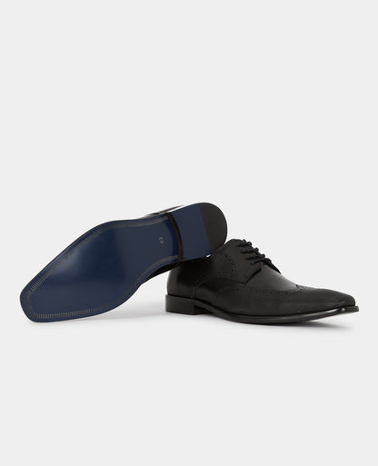 Man wearing a black Leather Russo Shoe