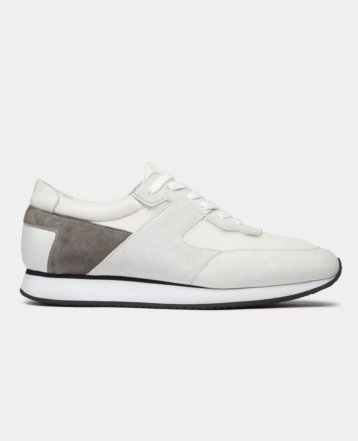 Man wearing a white Suede Trainer