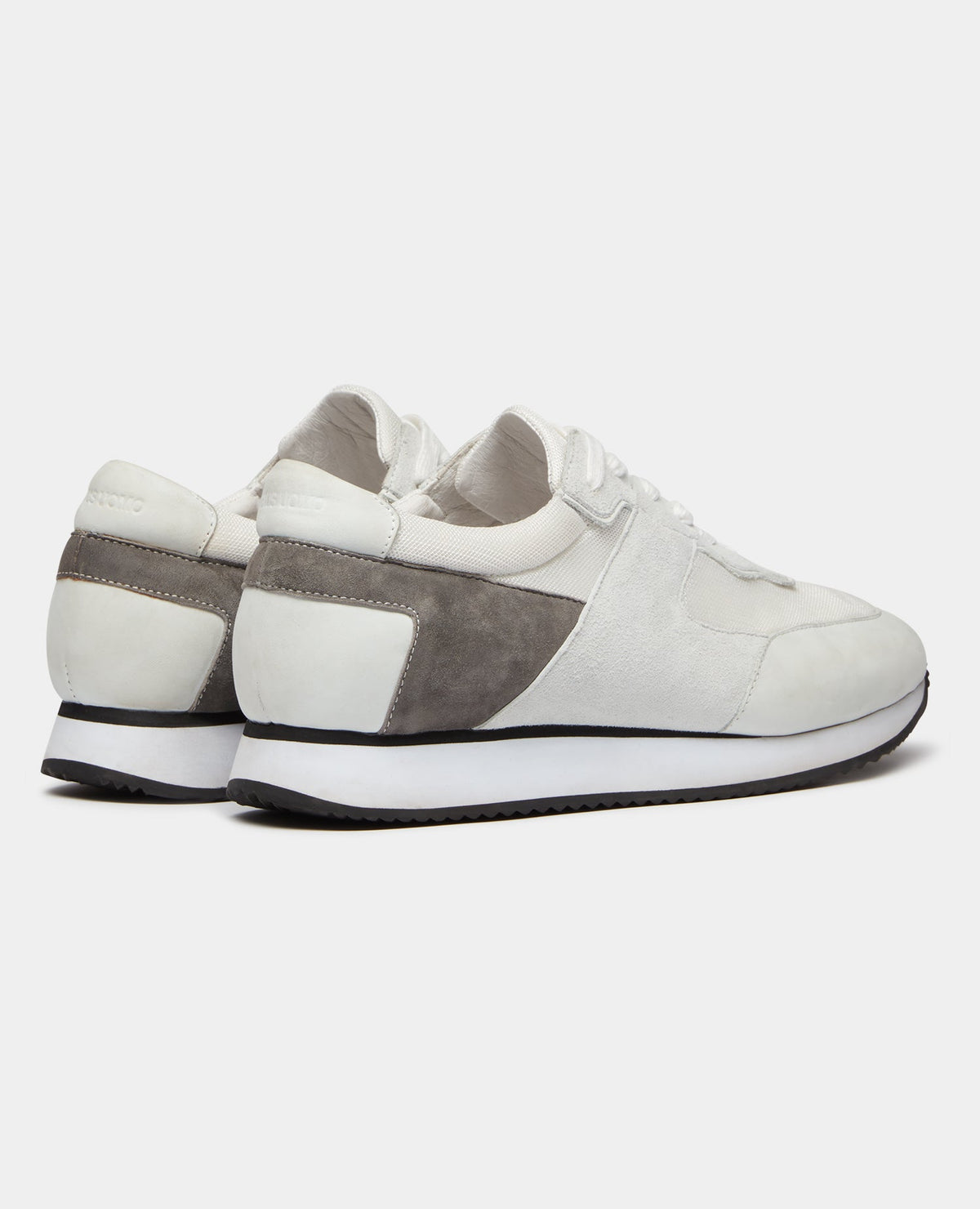 Man wearing a white Suede Trainer