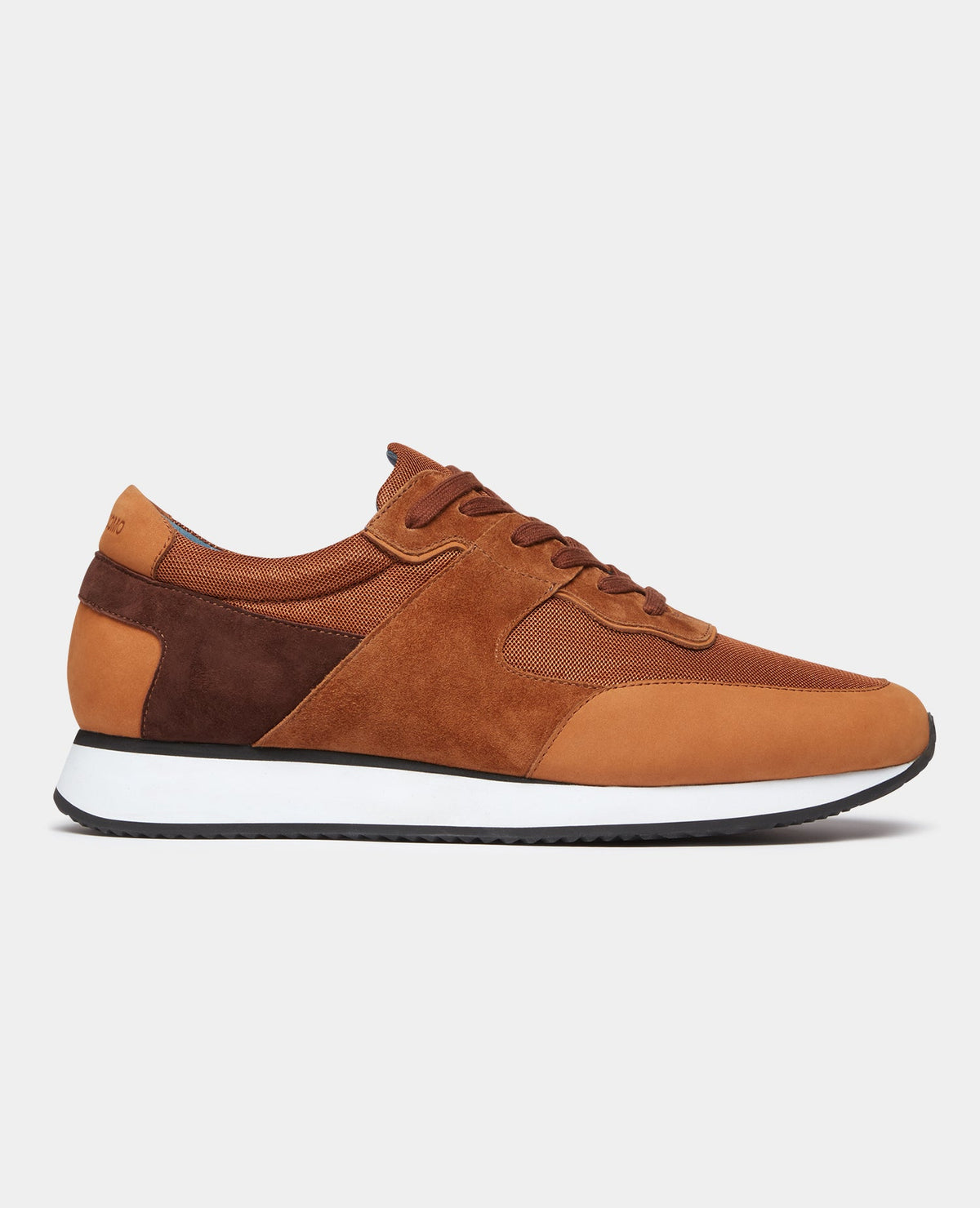 Man wearing a orange Suede Trainer