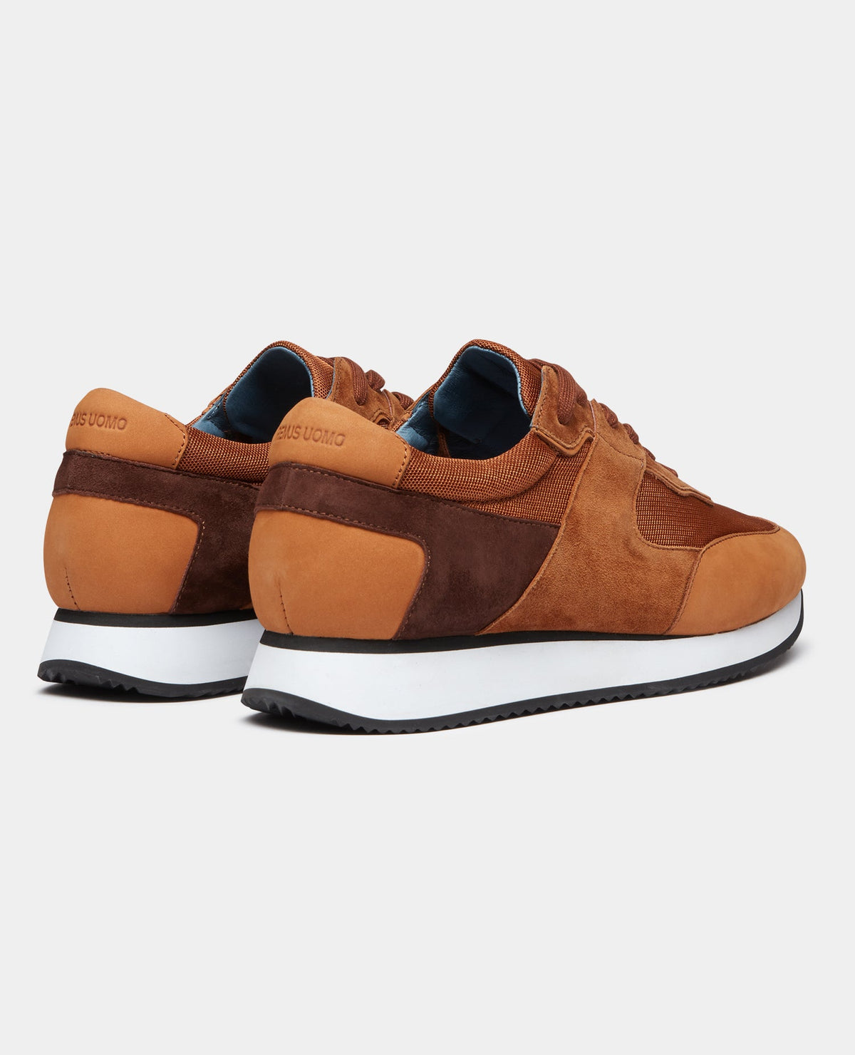 Man wearing a orange Suede Trainer