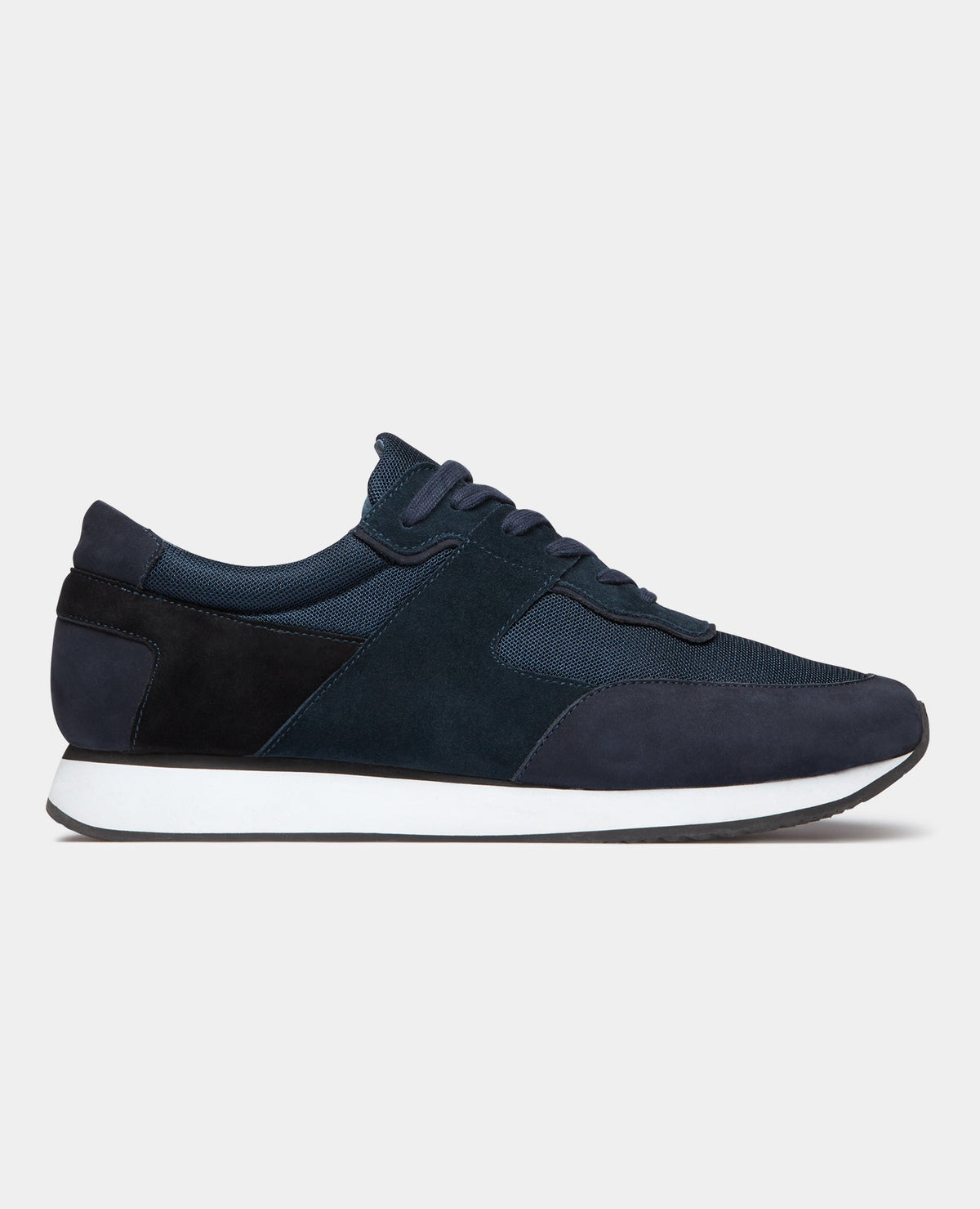 Man wearing a navy Suede Trainer