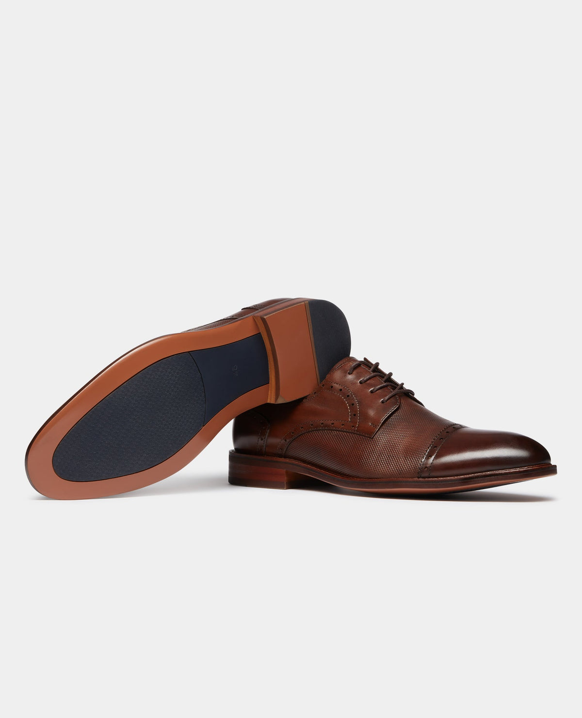 Man wearing a orange Leather Derby Shoe