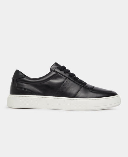 Man wearing a black Leather Trainer