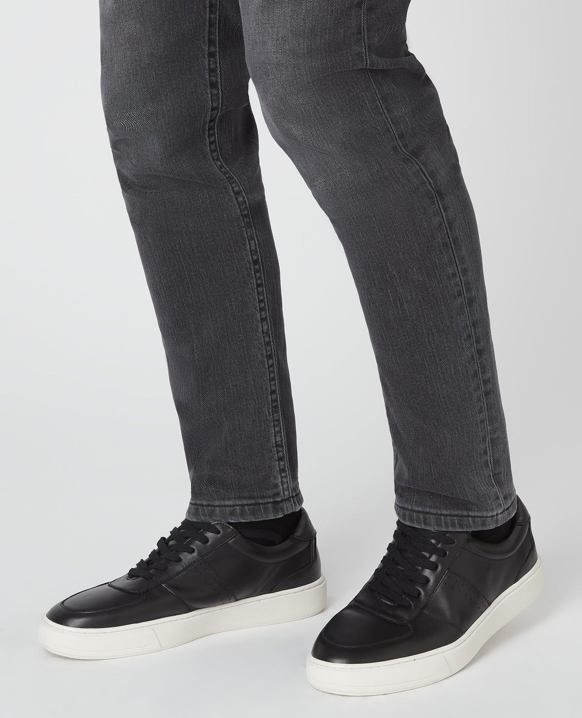 Man wearing a black Leather Trainer