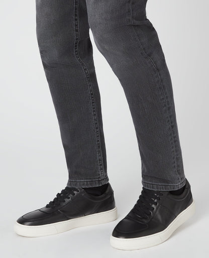 Man wearing a black Leather Trainer