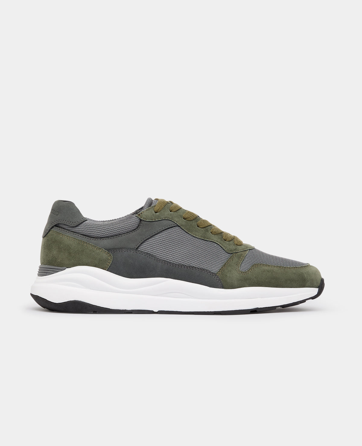 Man wearing a green Suede Albi Trainer