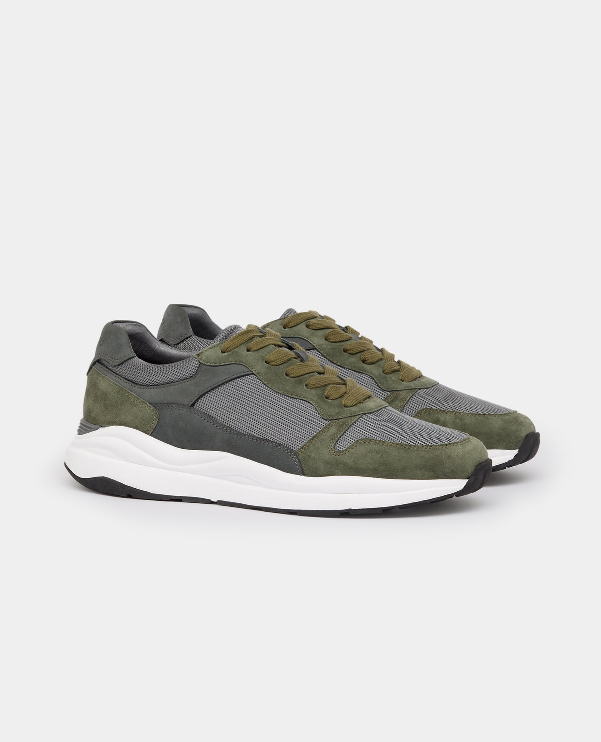 Man wearing a green Suede Albi Trainer