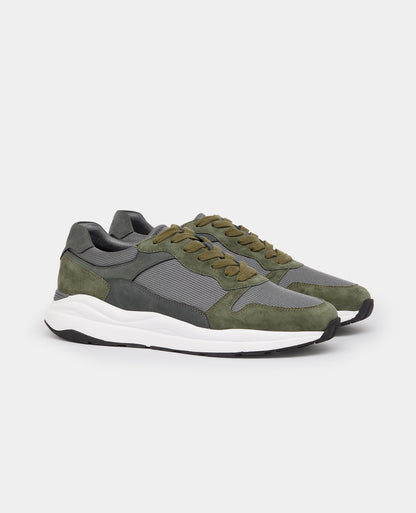 Man wearing a green Suede Albi Trainer