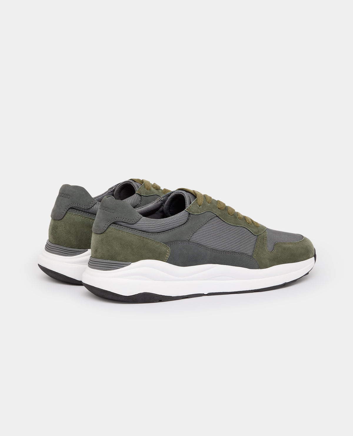Man wearing a green Suede Albi Trainer
