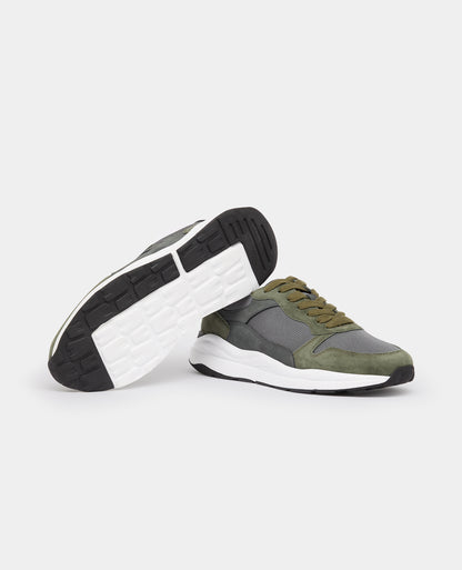 Man wearing a green Suede Albi Trainer
