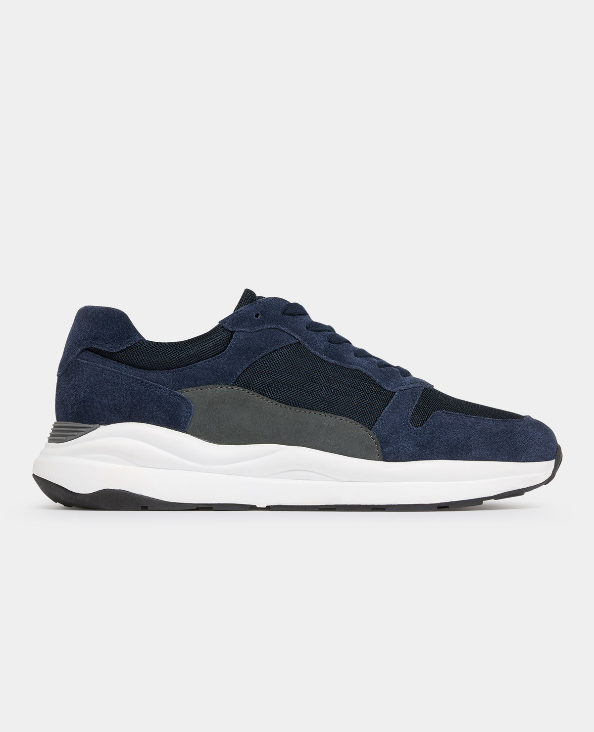 Man wearing a navy Suede Albi Trainer