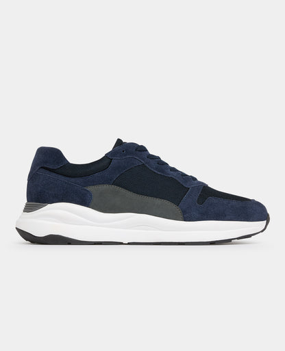 Man wearing a navy Suede Albi Trainer