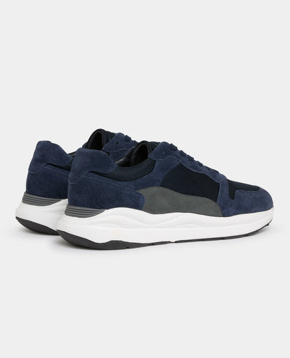 Man wearing a navy Suede Albi Trainer