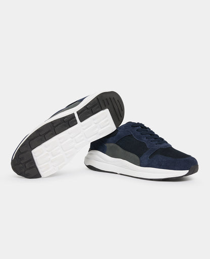 Man wearing a navy Suede Albi Trainer