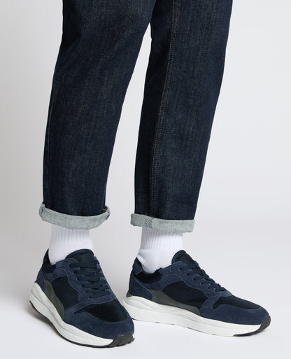 Man wearing a navy Suede Albi Trainer