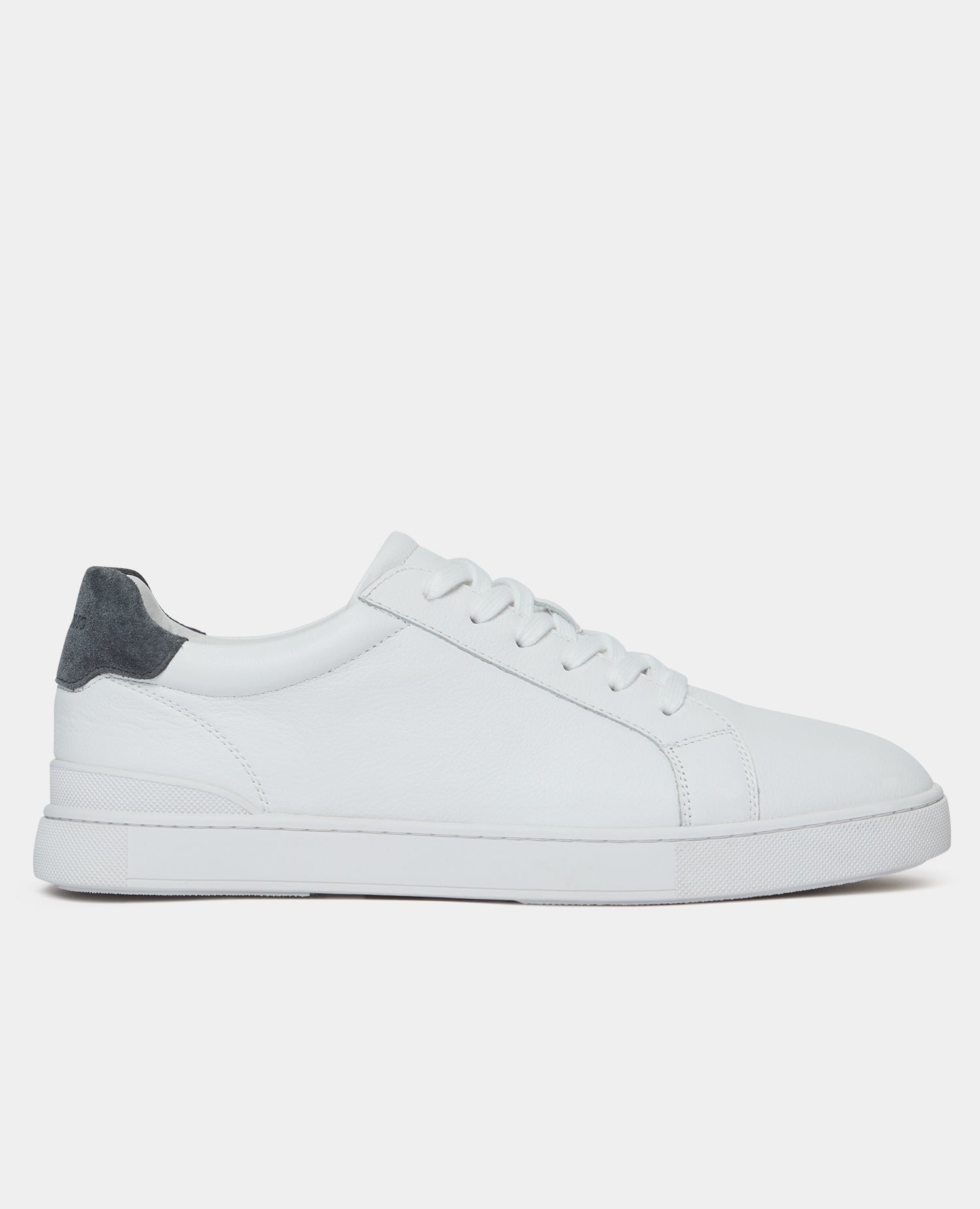 White sneaker with a gray heel on a white background