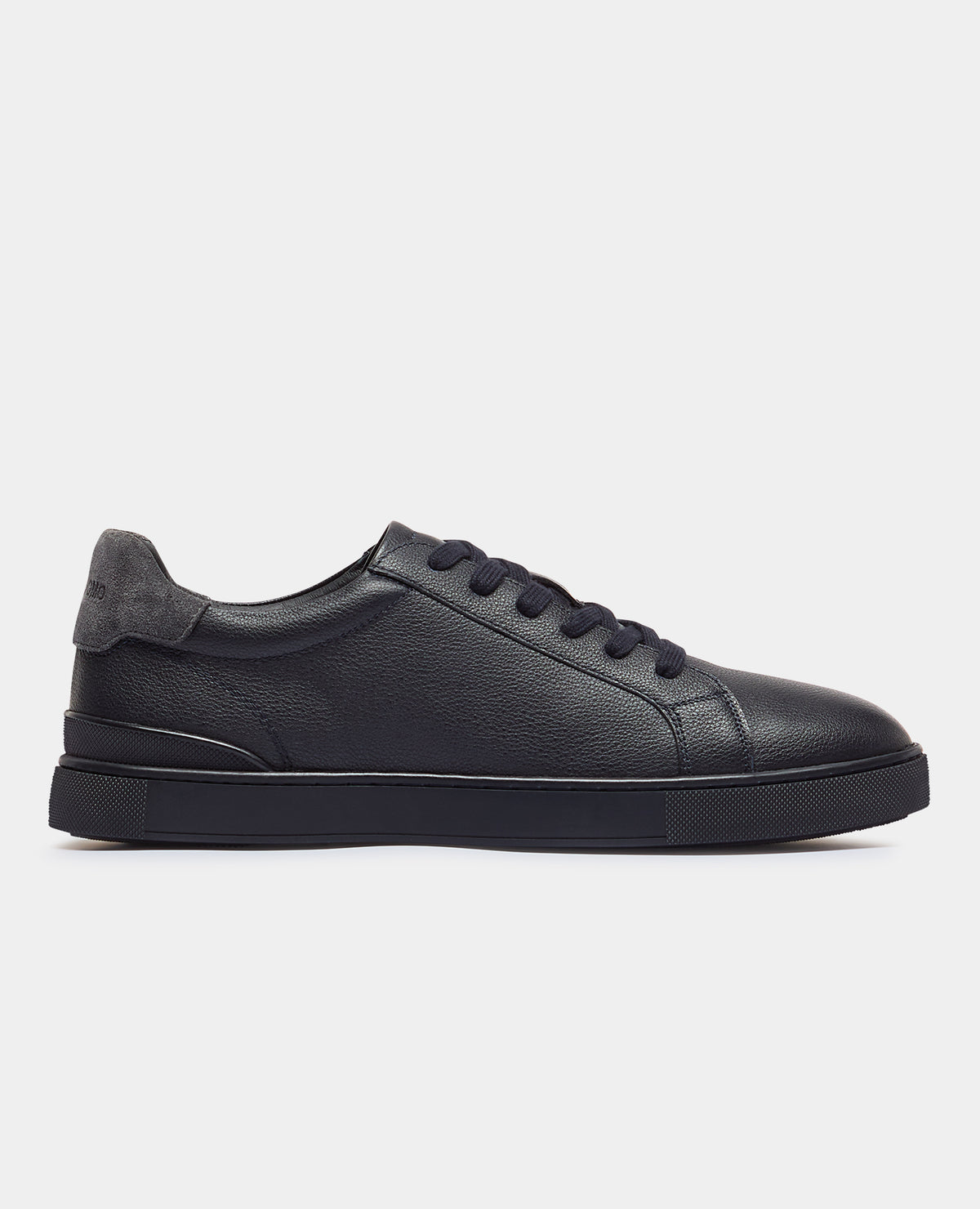 Man wearing a navy Shoe