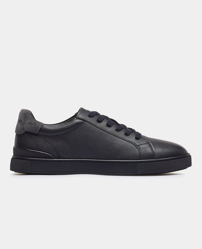 Man wearing a navy Shoe