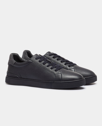 Man wearing a navy Shoe