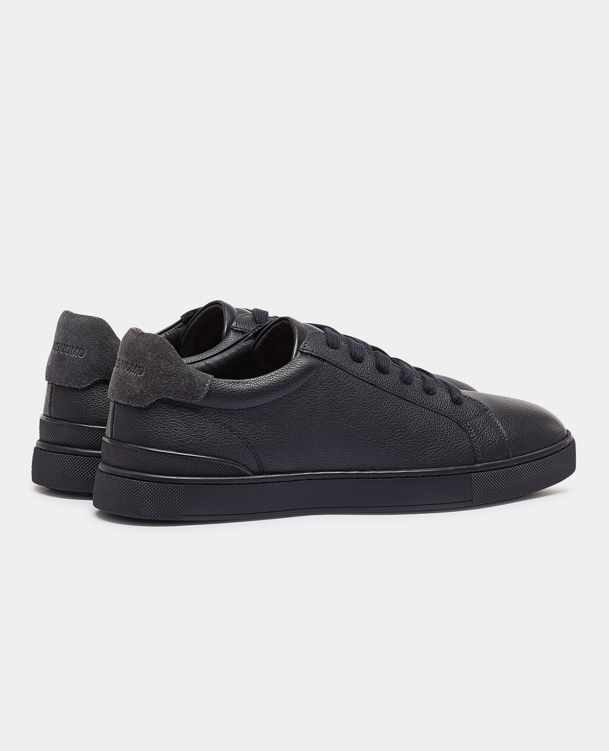 Man wearing a navy Shoe