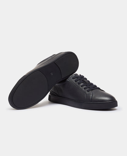 Man wearing a navy Shoe