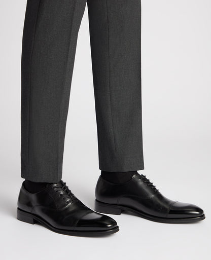 Man wearing a black Leather Garda Shoe